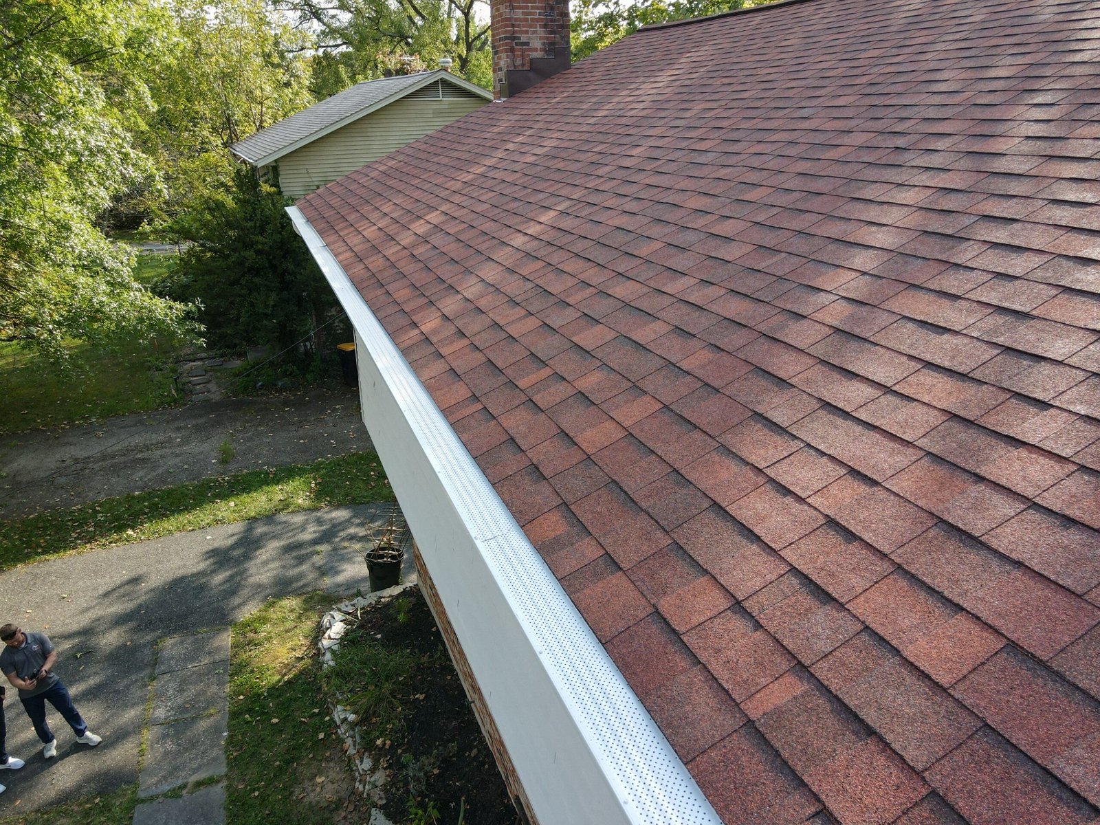 Completed roof by Bravo Roofing on a Maryland home, photographed from above