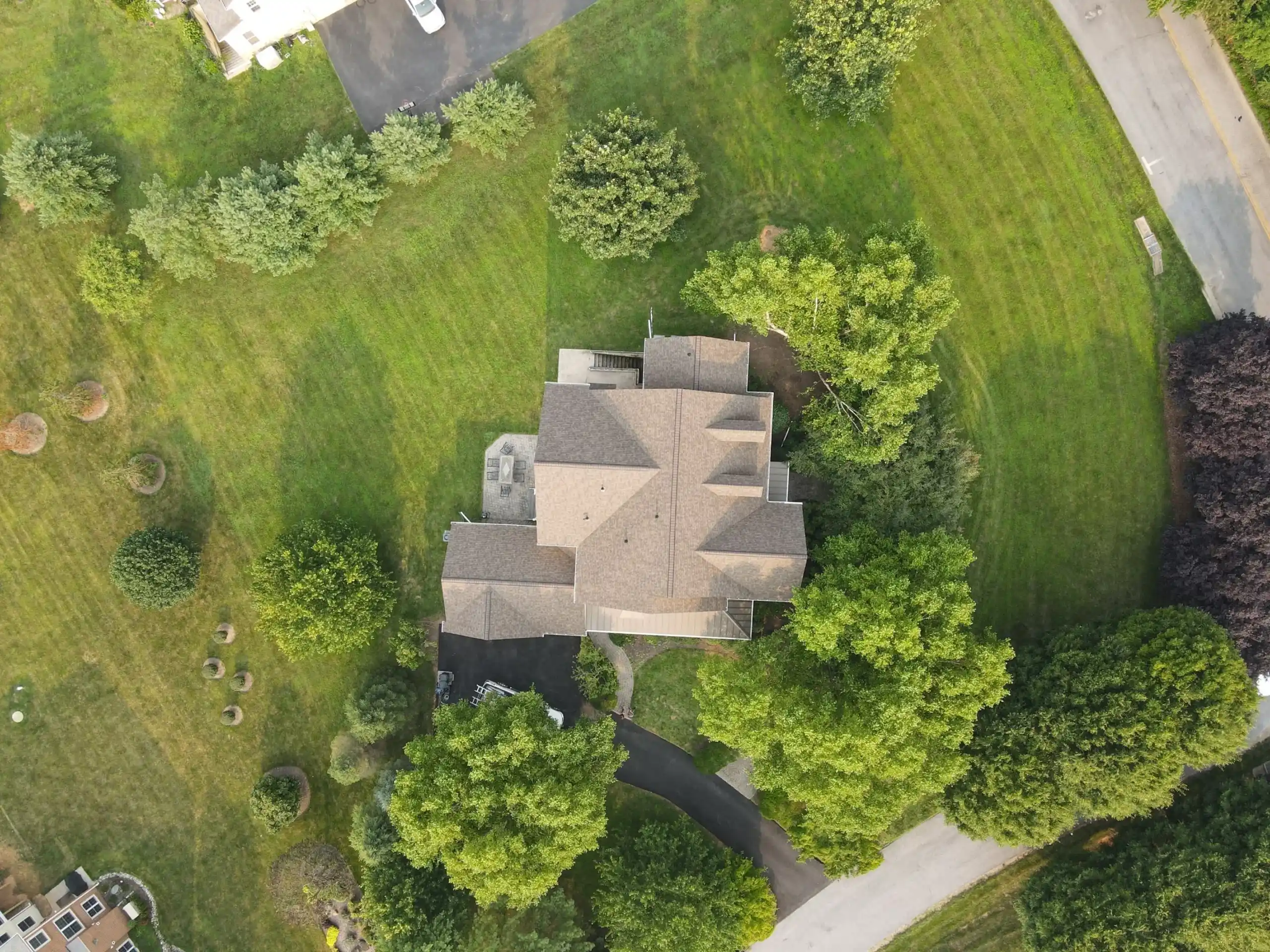 Completed roof by Bravo Roofing on a Maryland home, photographed from above
