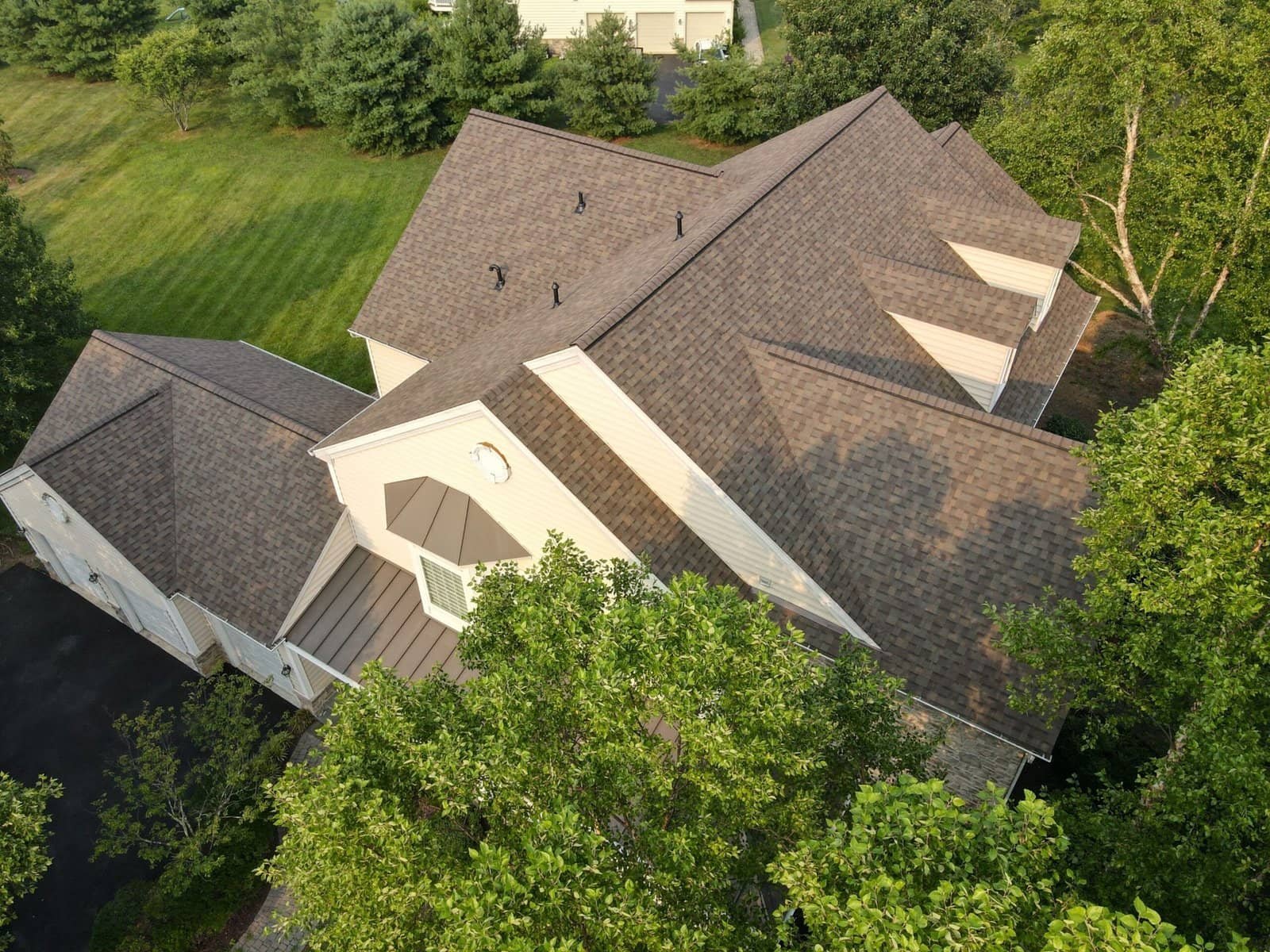 Completed roof by Bravo Roofing on a Maryland home, photographed from above