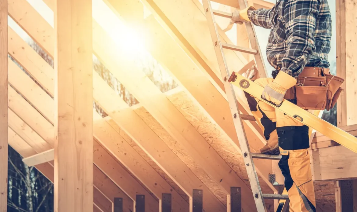 A construction contractor holding a spirit level, symbolizing the importance of quality in roofing repairs.